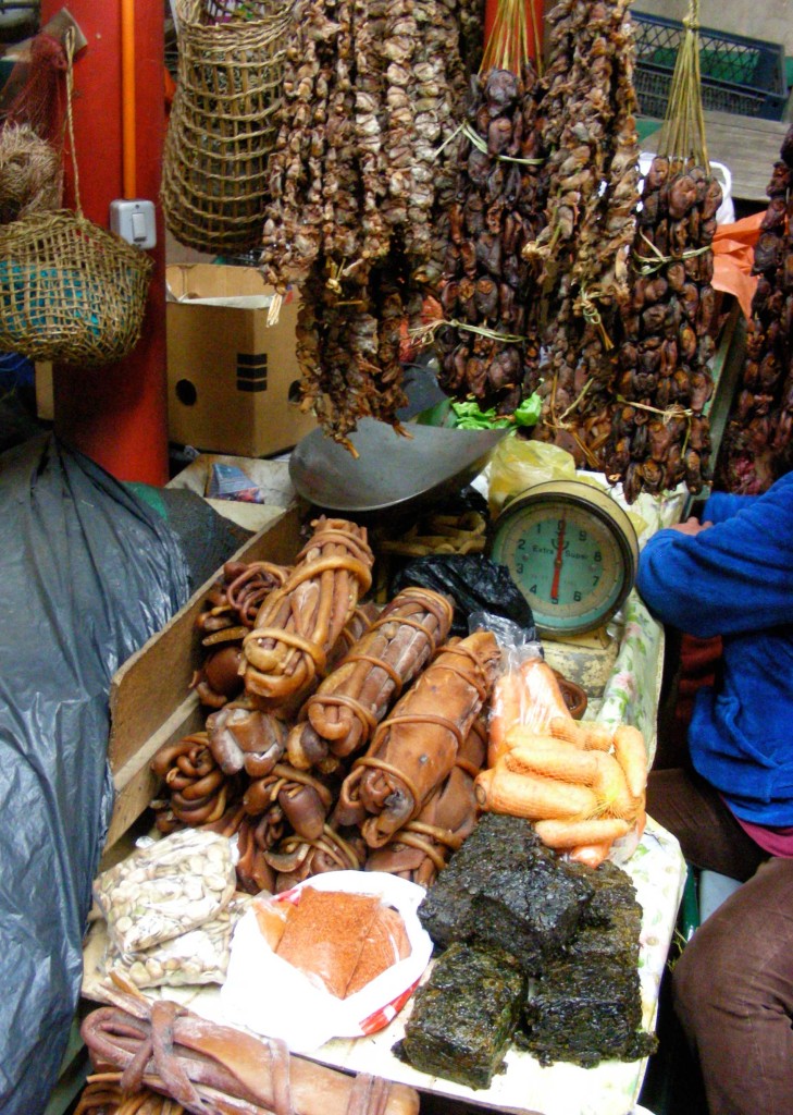 Strings of dried piure, bunches of dried cocayuyo kelp and luche (bottom right) at Castro Feria